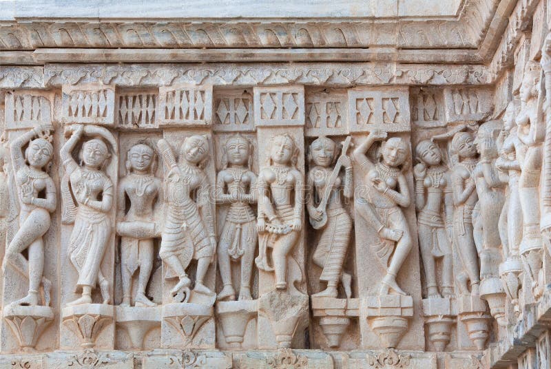 Bas-relief with Apsaras, Surasundaris and playing musicians at famous ancient Jagdish Temple in Udaipur, Rajasthan, India. It has been in continuous worship since 1651. Bas-relief with Apsaras, Surasundaris and playing musicians at famous ancient Jagdish Temple in Udaipur, Rajasthan, India. It has been in continuous worship since 1651.