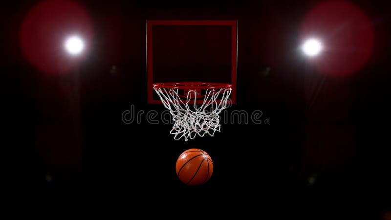 Baschet care trece prin coș pe fundal negru royalty free stock photos