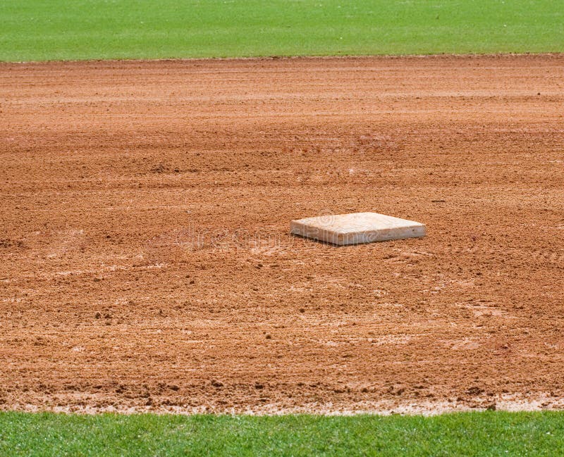 Base on infield of a baseball field. Base on infield of a baseball field
