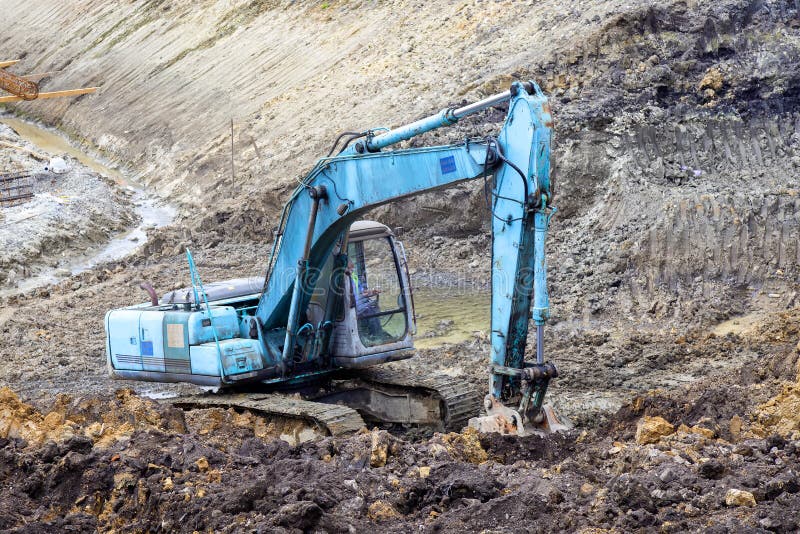 Pierres De Creusement De Machine Défonceuse Jaune D'excavatrice