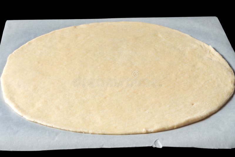 Base della pizza su una carta bollente immagine stock Base della pizza su una carta bollente immagine stock