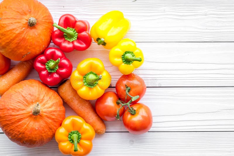 Base of healthy diet. Vegetables pumpkin, paprika, tomatoes, carrot on white wooden background top view copyspace stock photos Base of healthy diet. Vegetables pumpkin, paprika, tomatoes, carrot on white wooden background top view copyspace stock photos
