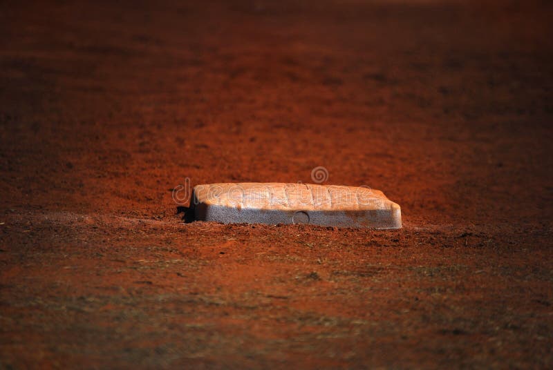 Dirty white baseball base and foul line