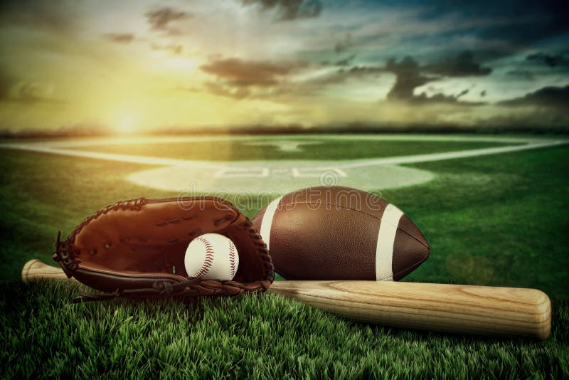 Baseball, bat, and mitt in field at sunset royalty free stock photos Baseball, bat, and mitt in field at sunset royalty free stock photos