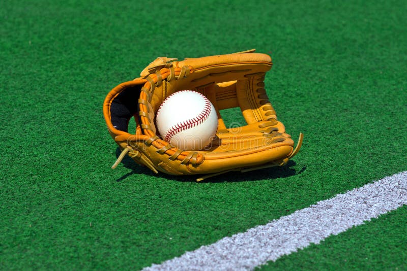 Baseball Glove and Ball on the Field Stock Image Image of stadium, field 63320577