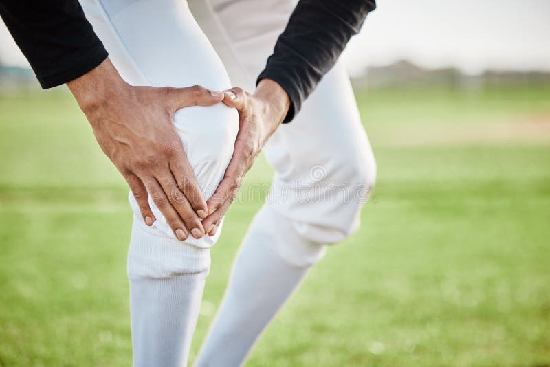 Baseball, pain and hands with knee injury on field after accident, fall or workout in match. Sports, training and player man with fibromyalgia, inflammation or broken leg, arthritis or tendinitis. Bad player stock images, royalty-free photos and pictures