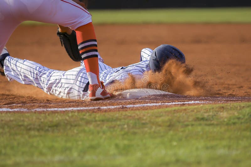 Baseball player sliding first base stock photography Baseball player sliding first base stock photography