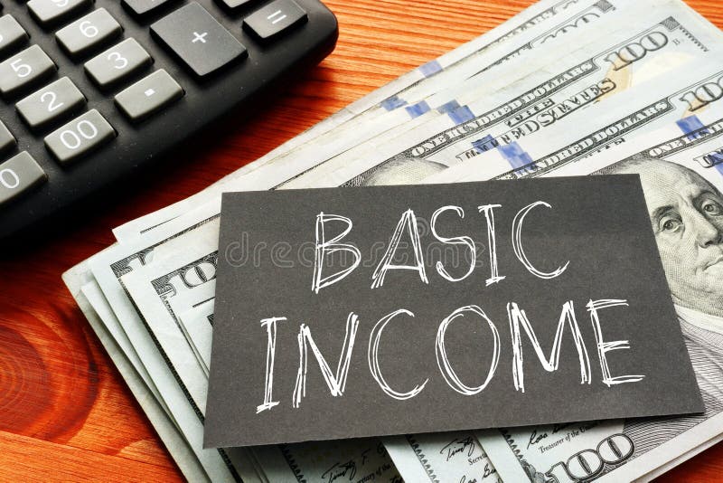Basic Income is shown using the text and photo of dollars royalty free stock photo