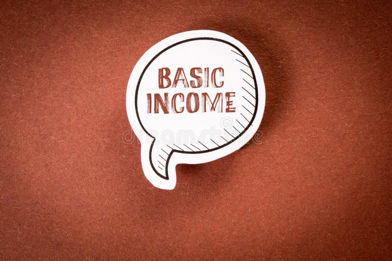 Basic Income. Speech bubble with text on brown background royalty free stock photos