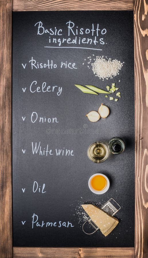 Basic risotto cooking ingredients on chalkboard background with text, top view. stock image