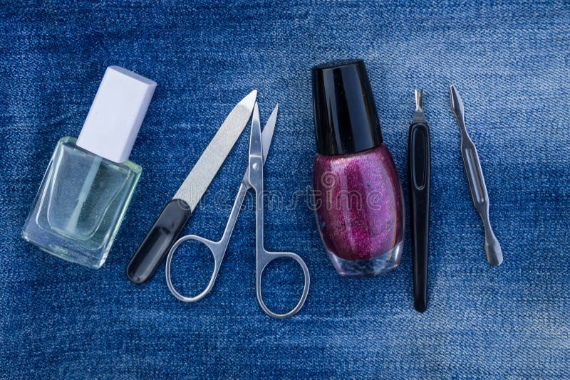 Basic set of manicure tools on jeans background royalty free stock image