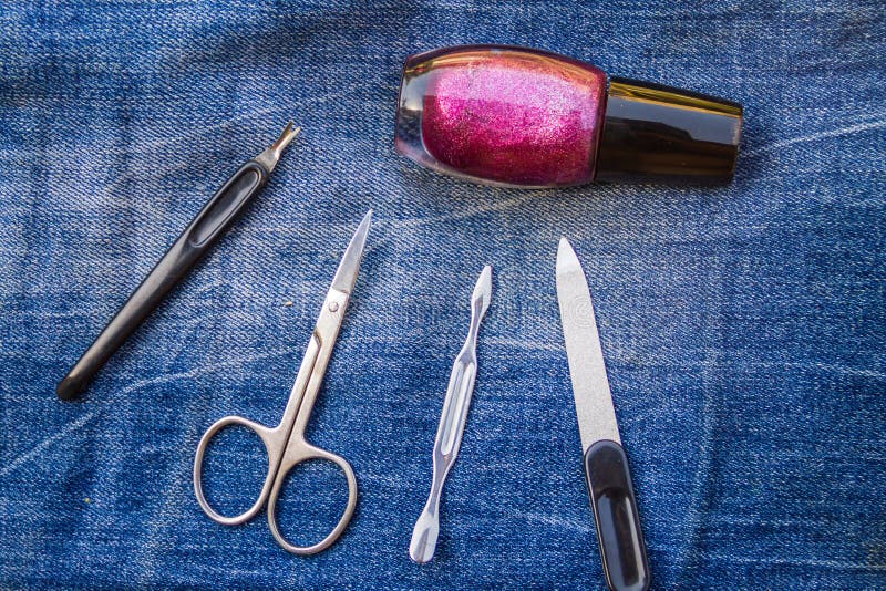 Basic set of manicure tools on jeans background royalty free stock images