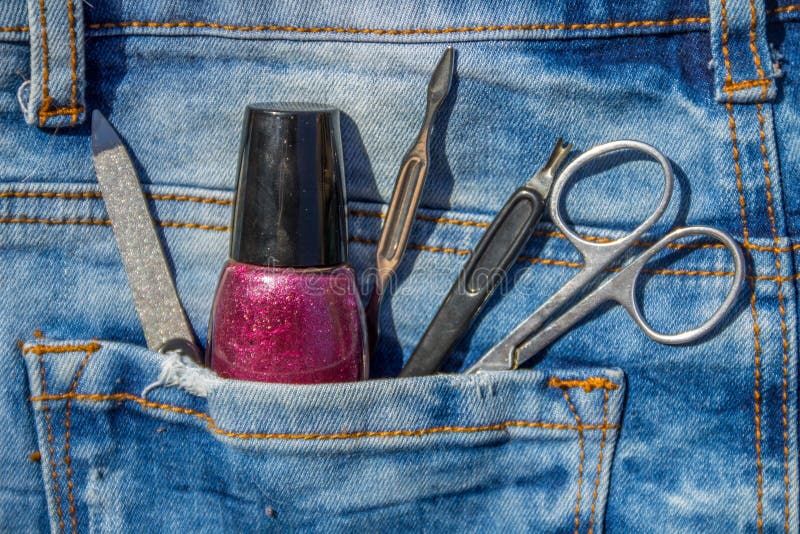 Basic set of manicure tools on jeans background royalty free stock image
