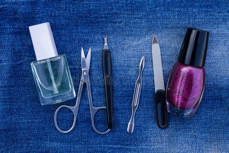 Basic set of manicure tools on jeans background royalty free stock image