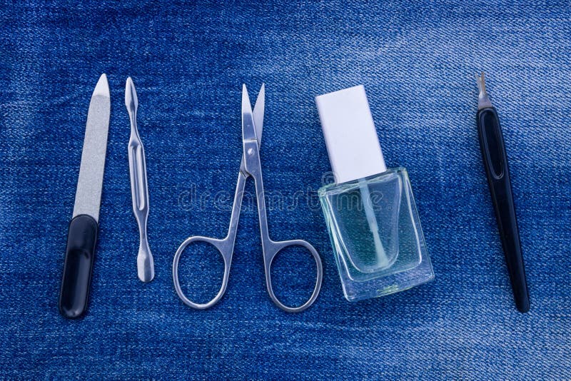 Basic set of manicure tools on jeans background royalty free stock images