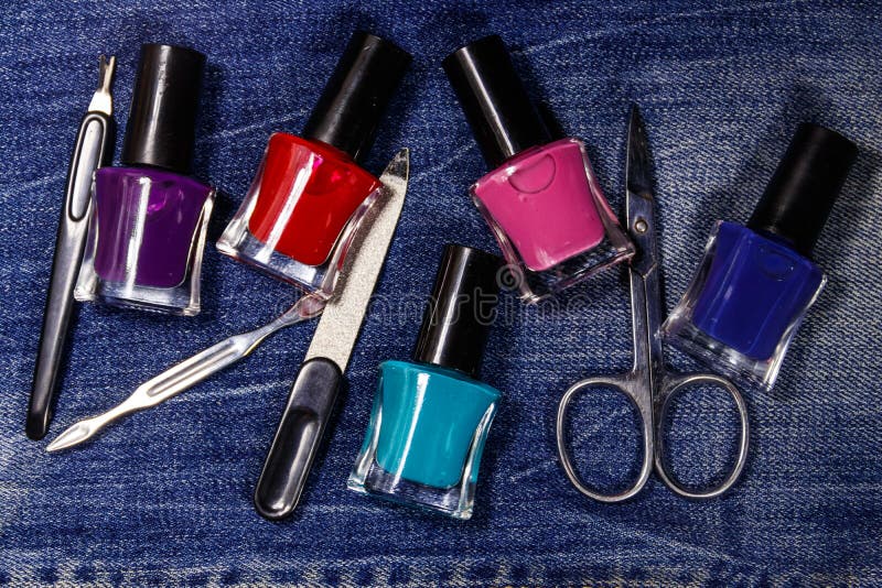 Basic set of manicure tools on jeans background royalty free stock photos