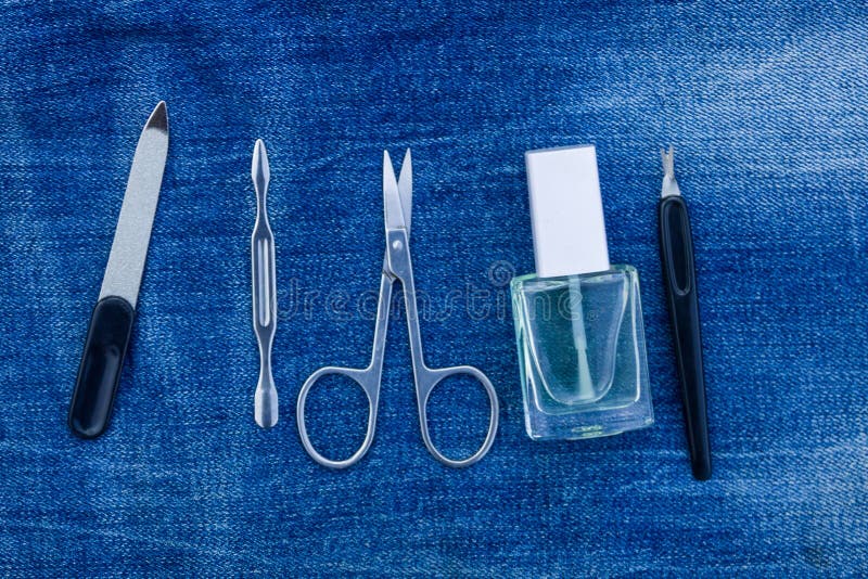 Basic set of manicure tools on jeans background royalty free stock photos