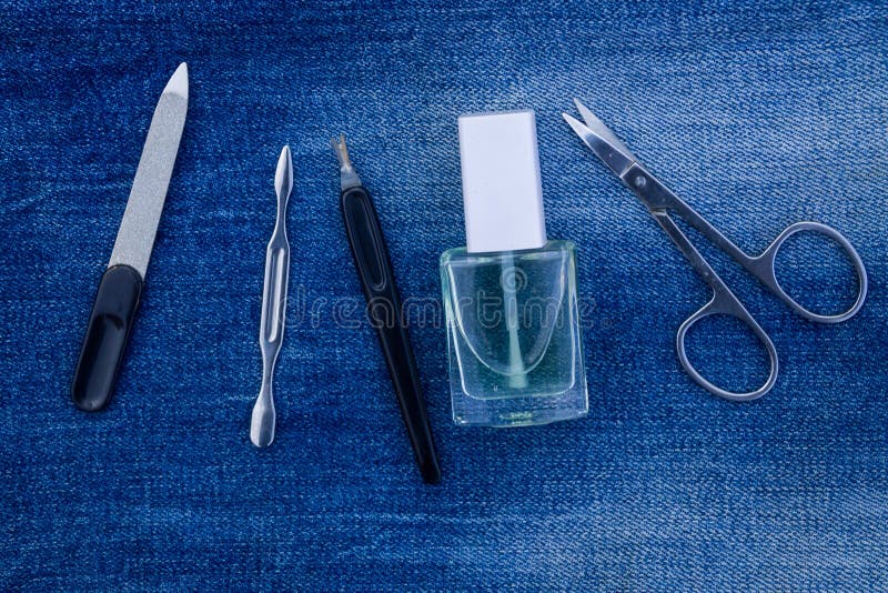 Basic set of manicure tools on jeans background royalty free stock photos