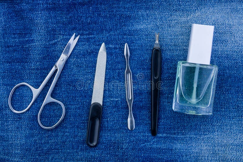 Basic set of manicure tools on jeans background stock photo