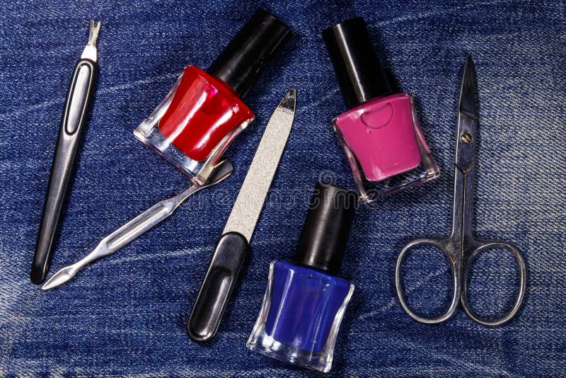 Basic set of manicure tools on jeans background royalty free stock photo