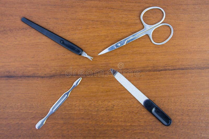 Basic set of manicure tools on wooden background royalty free stock image