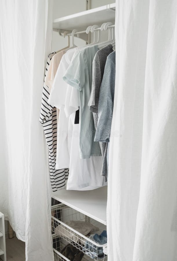 Basic Women Clothes on a Hanger, Open Wardrobe with Textile Curtains