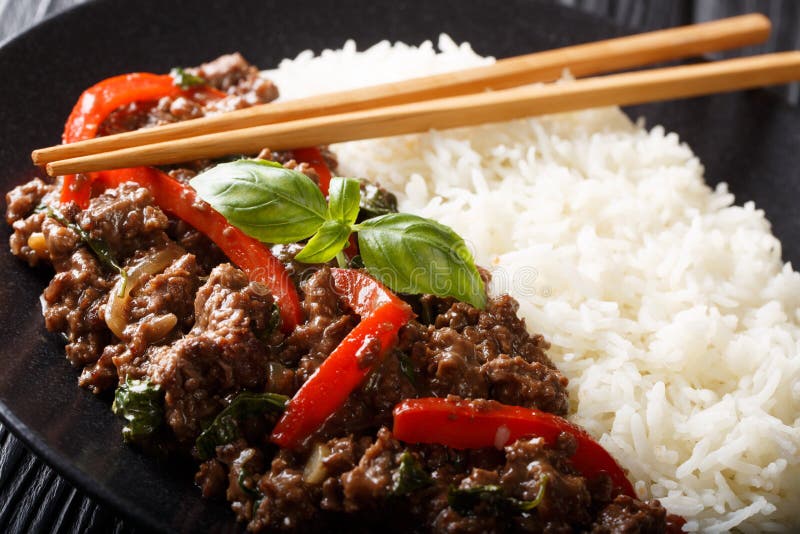 Basil Beef with Bell Pepper in a Spicy Sauce Served with Rice Closeup
