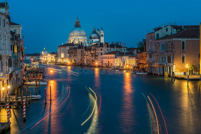 Basilica di Santa Maria della Salute and grand canal from Accademia Bridge at night in Venice, Italy. View of Basilica di Santa Maria della Salute and grand stock photo Basilica di Santa Maria della Salute and grand canal from Accademia Bridge at night in Venice, Italy. View of Basilica di Santa Maria della Salute and grand stock photo