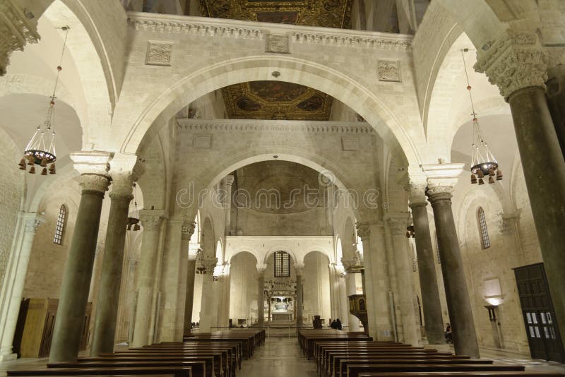 Imposing arches and white interior of saint nicholas church after mass  in the city Bari, apulia, italy. Imposing arches and white interior of saint nicholas church after mass  in the city Bari, apulia, italy