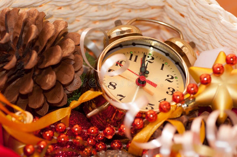 Basket with Christmas toys and clock hands