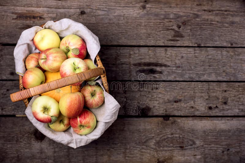 Basket of Fresh Ripe Apple and Pumpkin on Old Wooden Background Harvest Concept Autumn Fruits Top View Horizontal Copy Space