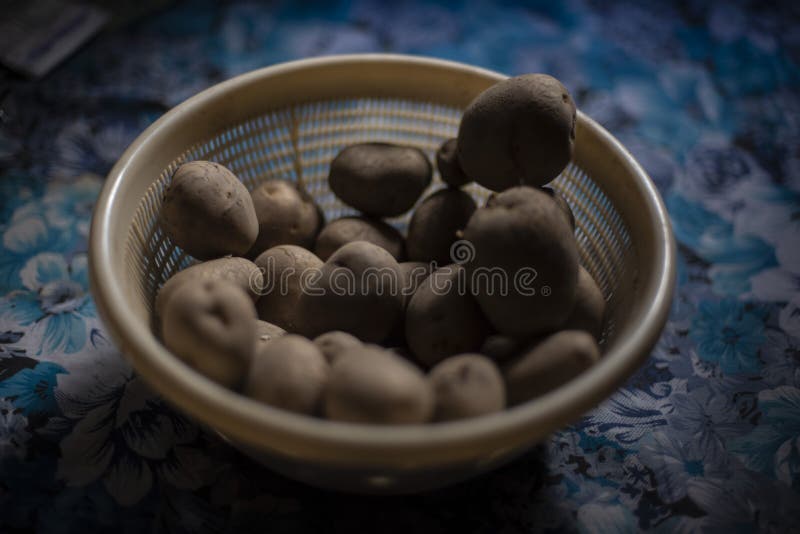 A basket full of potato kept in the Indian kitchen during the lock down period