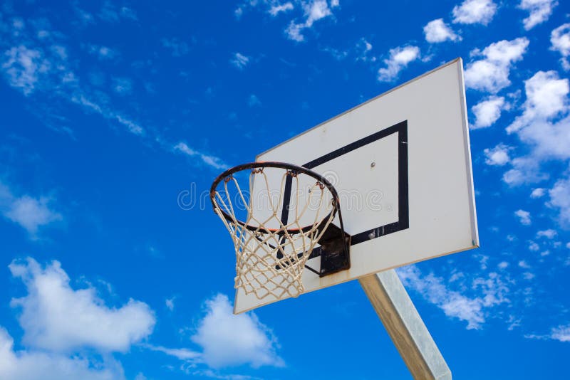 Basket hoop in a vibrant blue sky