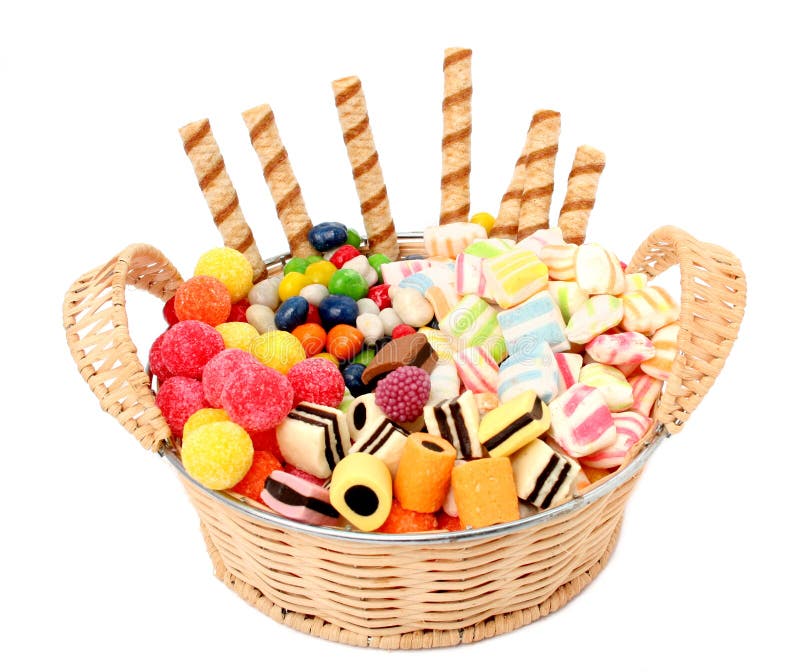 Basket with various sweets and the cookies, isolated