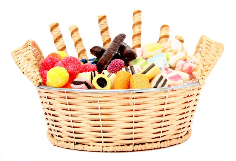 Basket with various sweets and the cookies, isolated