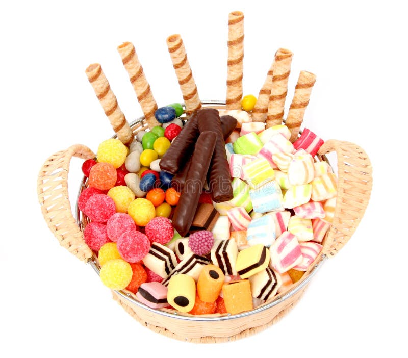 Basket with various sweets and the cookies, isolated