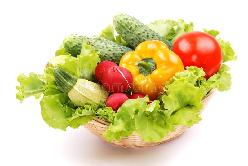 Basket with vegetables harvest on white