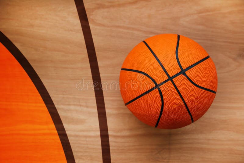 Basketball ball on court floor