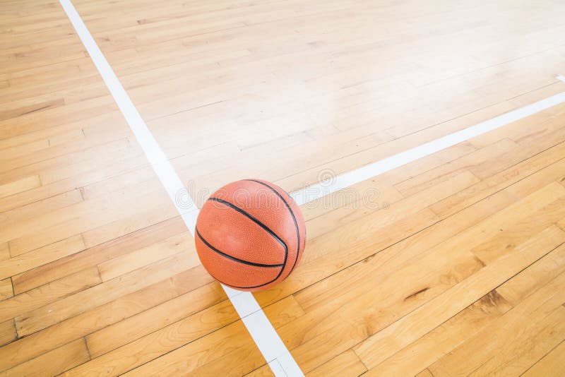 Basketball ball over floor