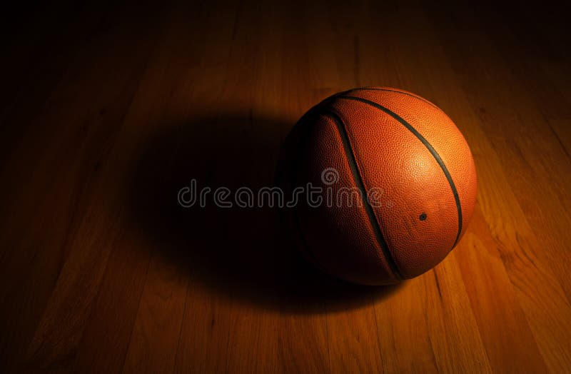 Basketball in dark background royalty free stock photography
