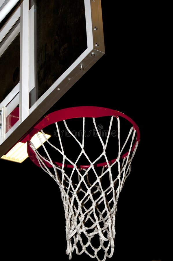 A basketball goal wating for a game to start.