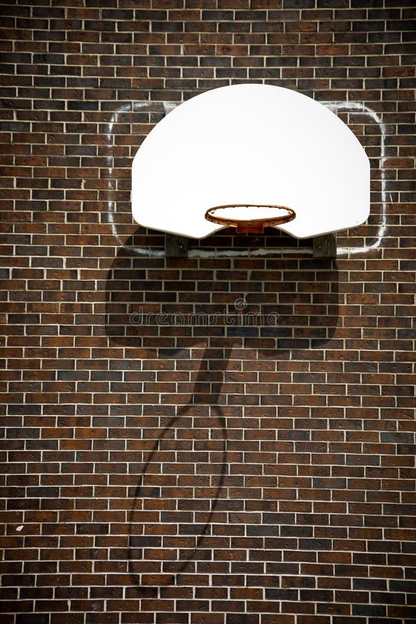 Basketball Hoop on Brick Wall