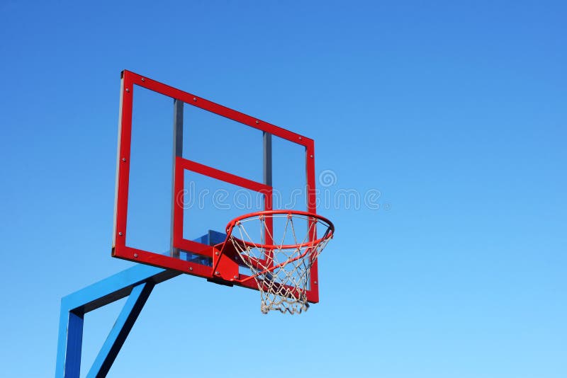 Basketball hoop on clear blue sky