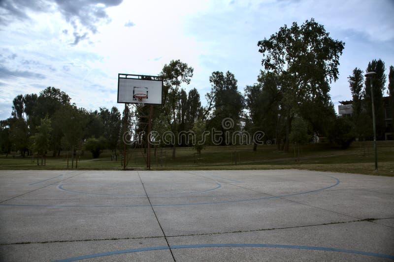 Basketball Hoop of a Basketball Court in a Public Park on a Cloudy Day