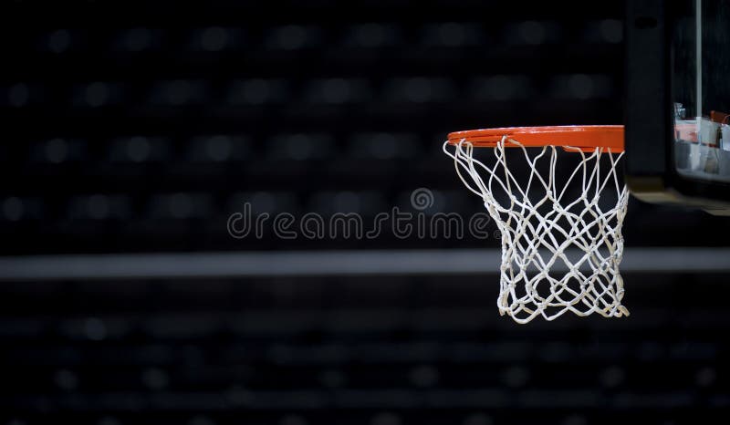 Basketball hoop isolated on black background.