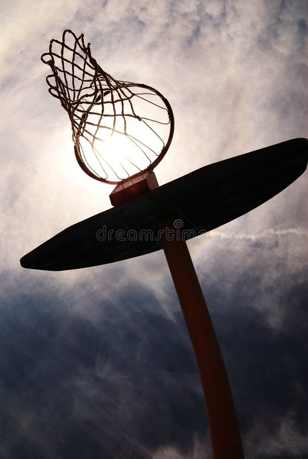 Basketball hoop silhouetted.