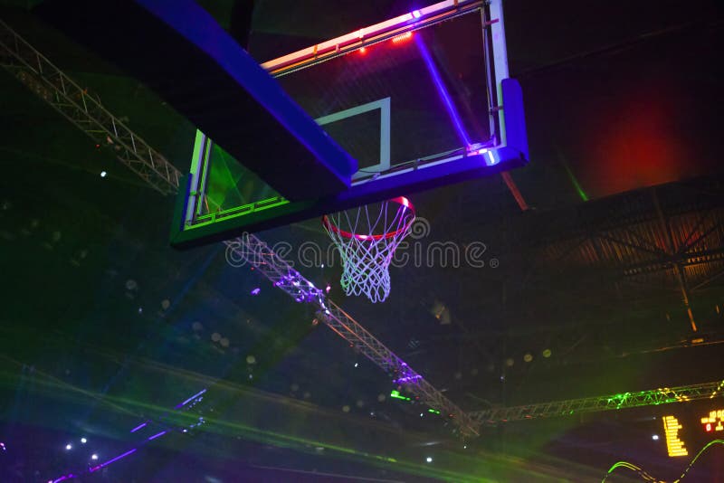 basketball hoop and sports arena in laser lights