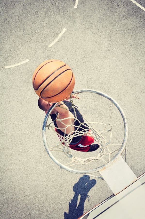 Basketball Player in Action Flying High and Scoring Stock Image Image