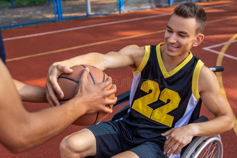 Basketball Player with Disability Training on Basketball Court Stock