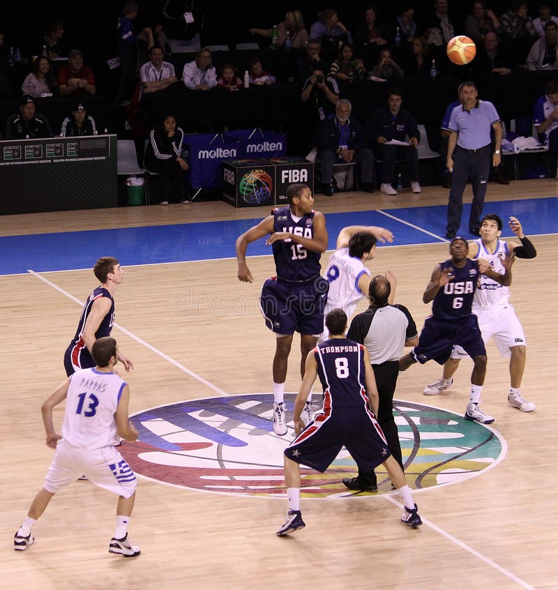 Basketball players rebounding